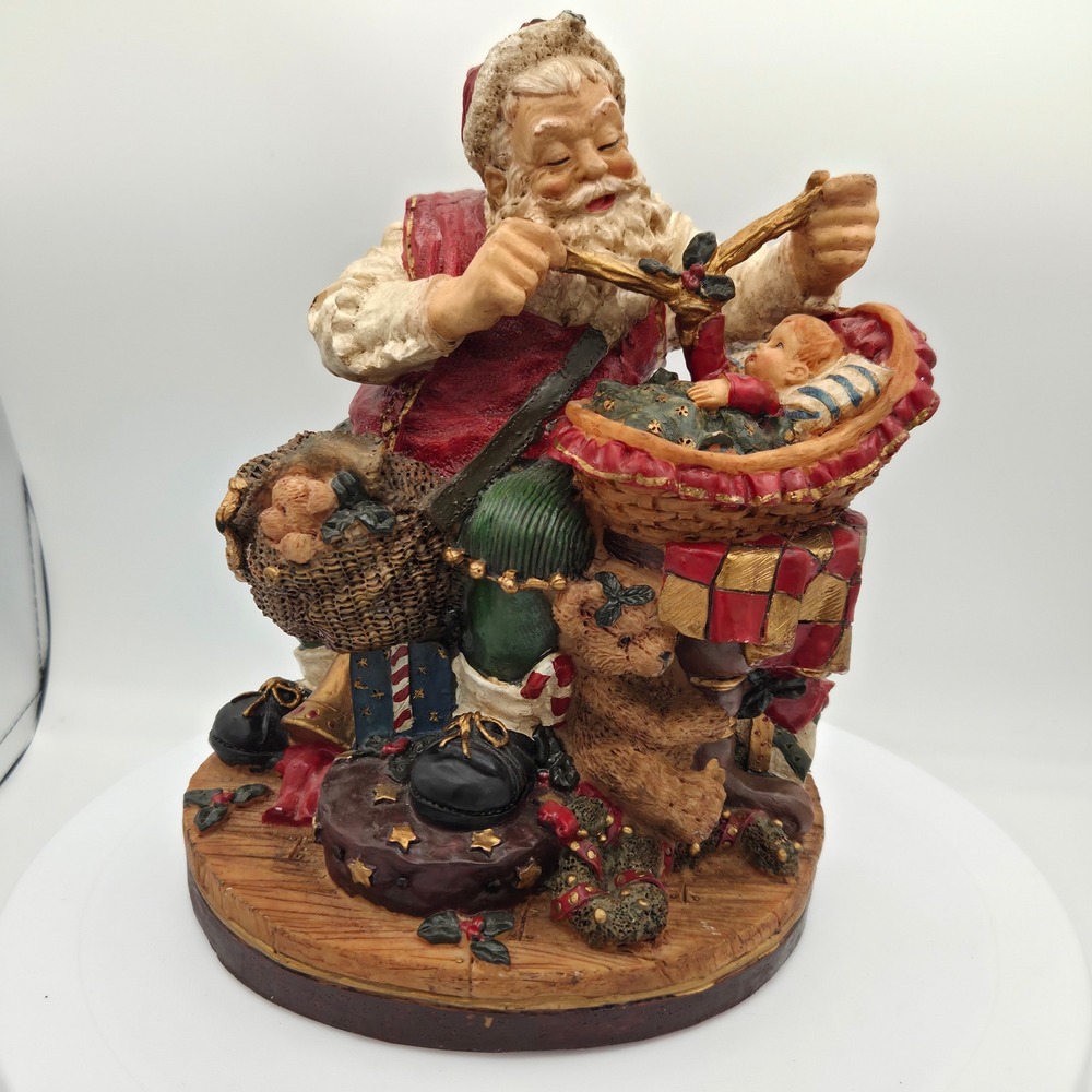 Three Hands Corp Santa‎ Claus Figurine with Baby and Toys Christmas Decor 99096